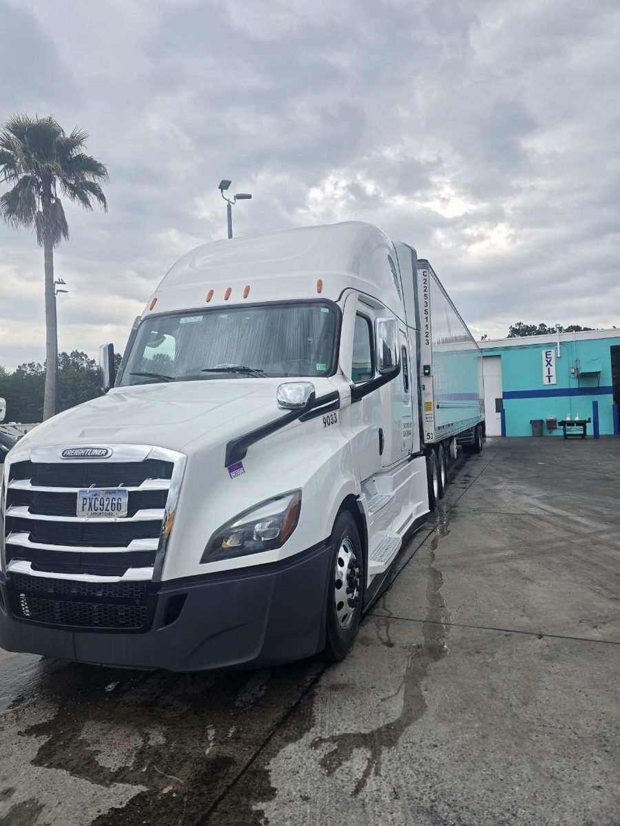 Ocean Wave Logistics Freightliner truck with dry van trailer